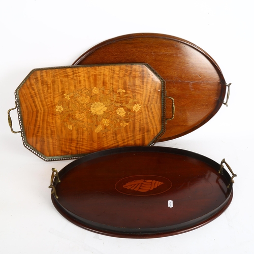 262 - A pair of late Victorian mahogany oval brass-handled serving trays, with decorative shell inlay, and... 