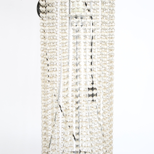 265 - A modern floor standing lamp with plastic lustres, height 112cm