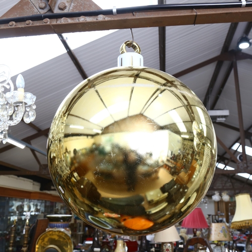 267 - A large decorative Christmas bauble, gold in colour, diameter 52cm