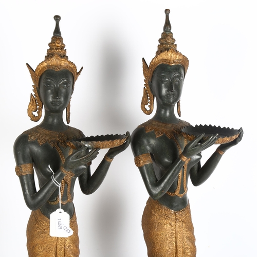 268 - A pair of ceremonial Thai figures, made from spelter, and carrying serving trays, height including b... 