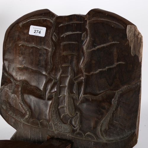 274 - A carved African wood 2-section chair, with the frontal view of an elephant carved into the back of ... 