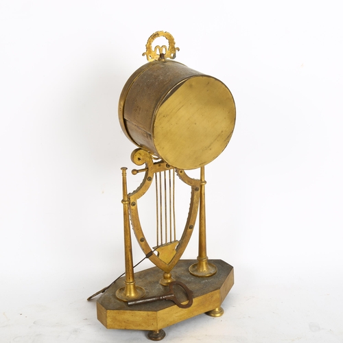 289 - An 8-day brass drum clock, dial is Roman numerals and in A/F condition, height 34cm