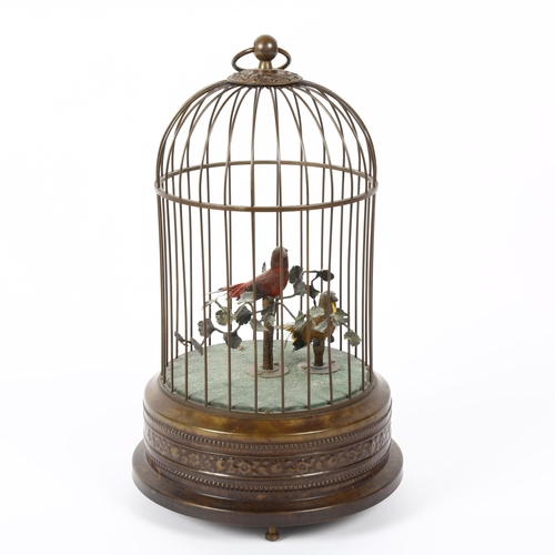 3 - A mid-20th century Swiss singing bird automaton, depicting 2 birds on branches within brass birdcage... 