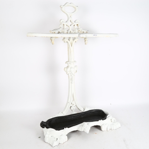 307 - A cast-iron umbrella stand, painted white, tray is painted black, height 74cm, width 45cm