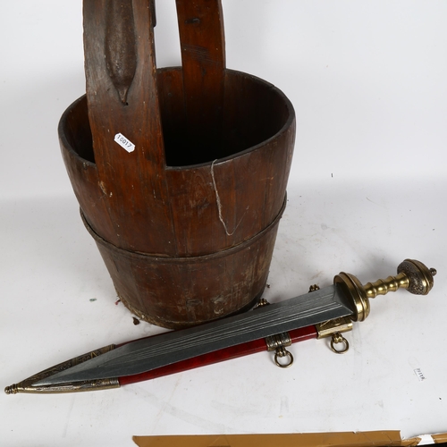 312 - An Antique stave wood and banded iron piggen well bucket, and a replica sword of Julius Caesar 1st c... 