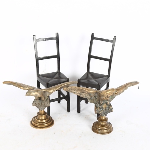 320 - An opposing pair of cast-bronze eagle figures, wingspan 18cm, and a pair of patinated bronze miniatu... 