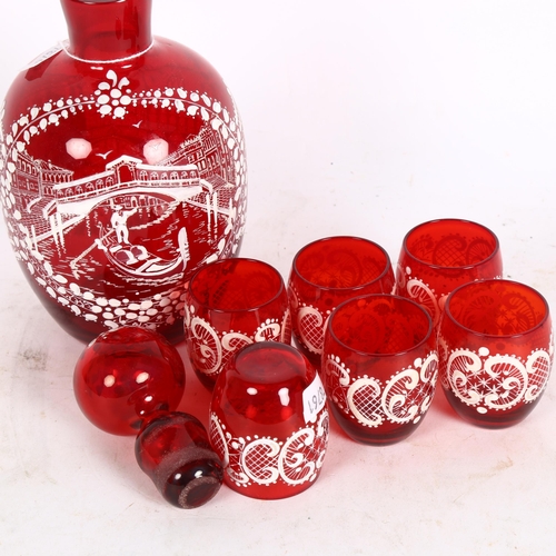 337 - Bohemian overlay decanter and shot glasses, ruby red in colour and decorated with a Venetian scene o... 