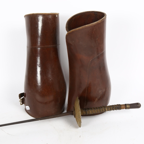 34 - A Vintage fencing foil, and a pair of leather gaiters, height 31cm (2)