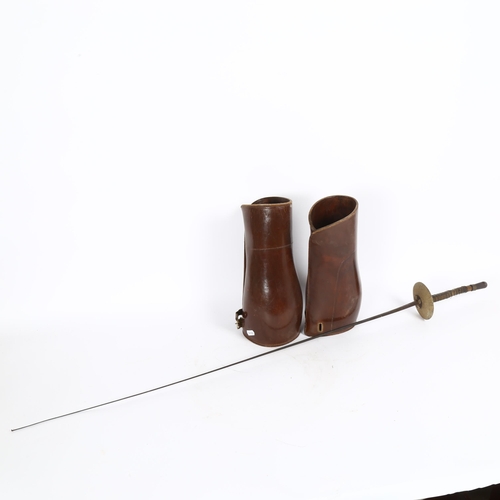 34 - A Vintage fencing foil, and a pair of leather gaiters, height 31cm (2)