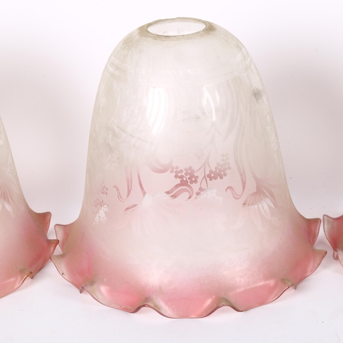 352 - A set of 3 Victorian glass lamp shades with etched decoration and cranberry rims, height 21cm