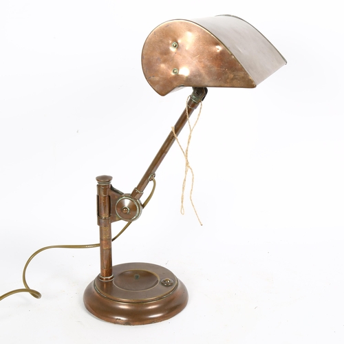 41 - An Antique copper student's desk lamp, with swivel shade, height 43cm