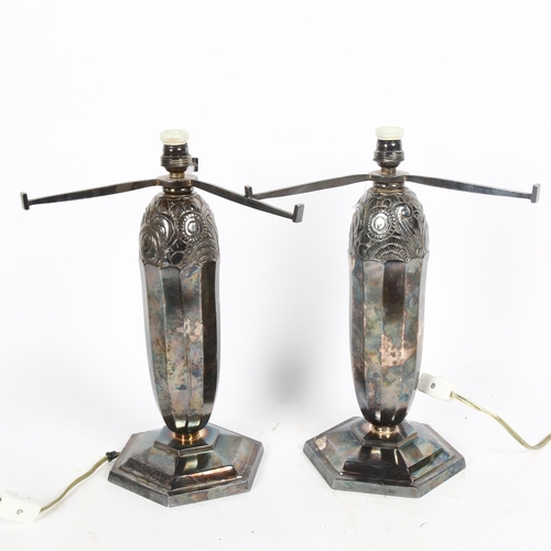 43 - A pair of Art Deco silver plated table lamps, relief embossed decoration with octagonal bases, heigh... 