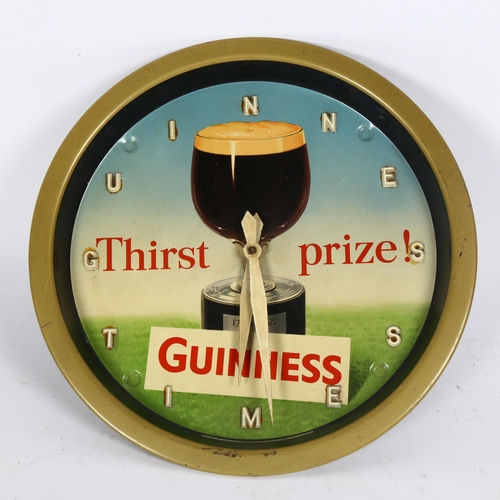 49 - A Vintage Guinness Time Thirst prize wall clock, printed by Reginald Corfield Ltd, with pine cone we... 