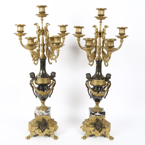 5 - A pair of Louis XVI style Italian bronze and marble 7-light table candelabra, with cherub monopodia ... 