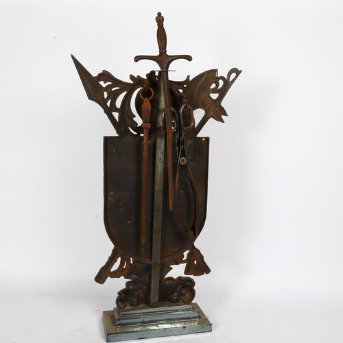 55 - A mid-20th century iridescent cast-iron Sexton Shield fire companion set, comprising stand, sword po... 