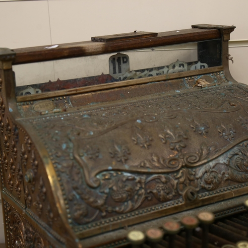 62 - A National cash register, relief embossed brass fleur-de-lis decoration, with white marble change pl... 