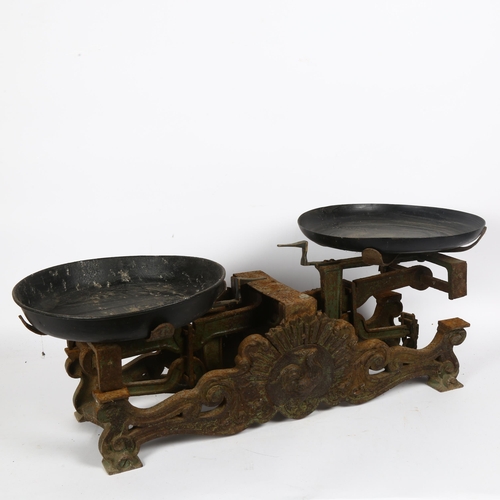 63 - An Antique set of cast-iron balance scales, with relief cockerel motif, width 62cm