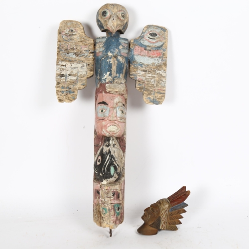 65 - A Canadian Native American carved and painted totem pole, height 50cm, and a Native American figural... 