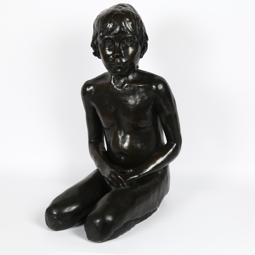 9 - A life-sized bronzed composition figural sculpture, nude seated boy, unsigned, height 58cm