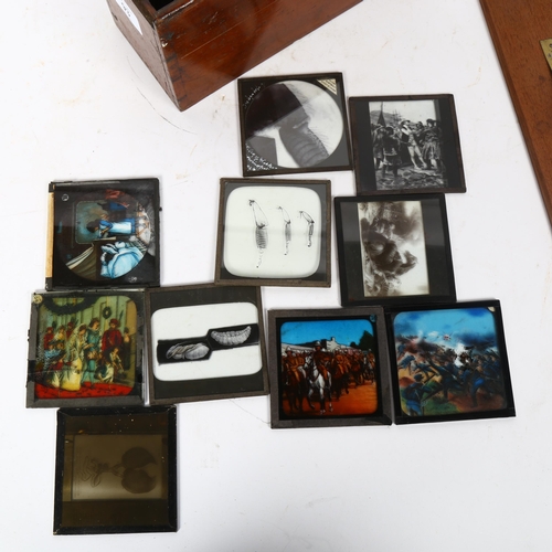 93 - An Antique mahogany magic lantern slide case and 8 various slides