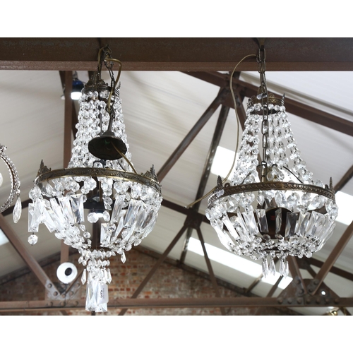 540 - A pair of brass bell-shaped ceiling chandeliers, with glass lustres