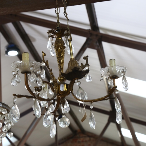 541 - A brass bell-shaped ceiling light, with glass lustres, and a brass Art Nouveau style light chandelie... 