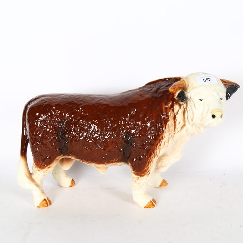 552 - A large porcelain bull, height 26cm