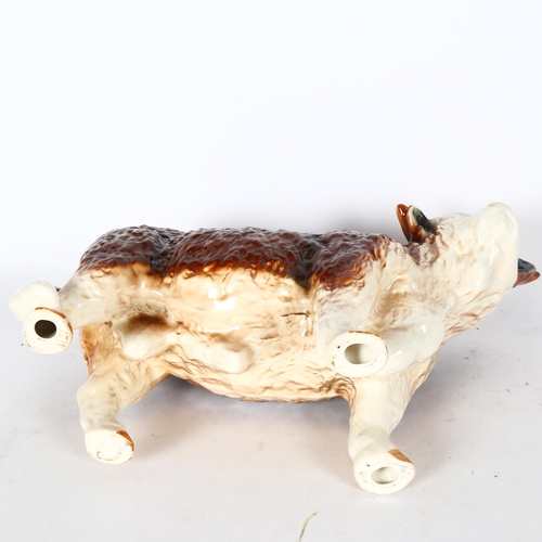 552 - A large porcelain bull, height 26cm