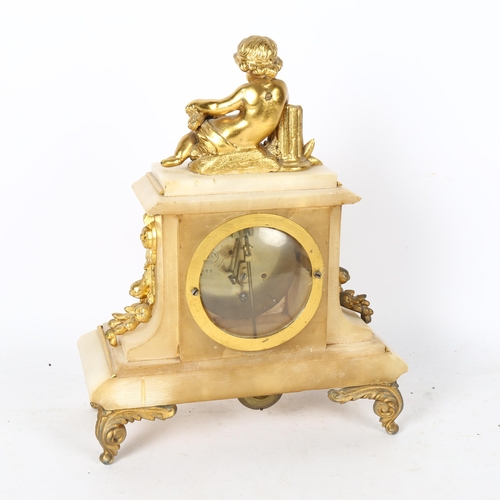 557 - A marble and gilt-metal mantel clock, surmounted by a cherub, height 29cm