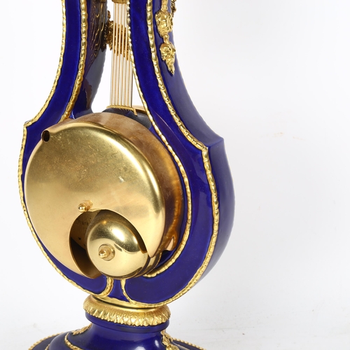 558 - A replica Marie-Antoinette clock from the Victoria & Albert museum, gilded blue glaze porcelain in l... 