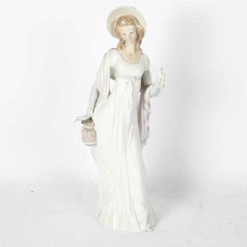 563 - Lladro figure of an Edwardian lady, 34.5cm