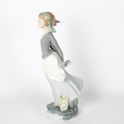 565 - Lladro girl with basket and book, 36cm