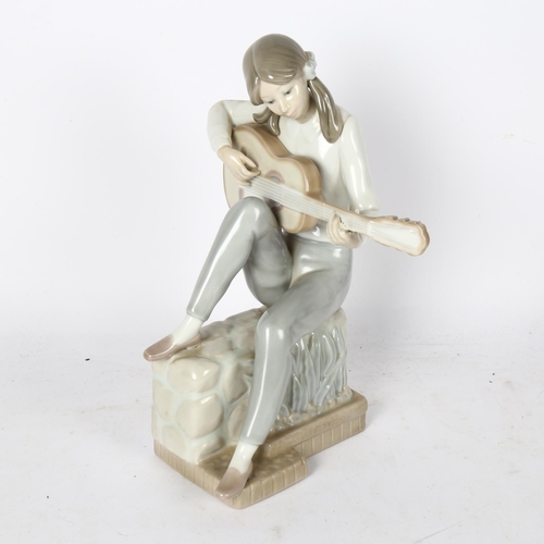 567 - NAO sculpture of a girl playing a guitar, 25cm