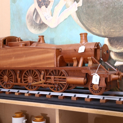 718 - A large scratch-built wooden steam engine and carriage, and 2 sections of track, steam engine length... 