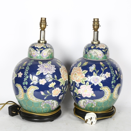 732 - A pair of Oriental ceramic table lamps with enamelled decoration, height overall 45cm