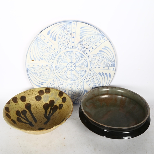 743 - 2 Studio pottery bowls, and a blue and white charger, 34cm