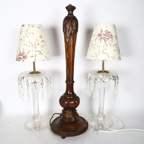 748 - A carved wood table lamp, 62cm, and a pair of table lamps with lustre drops