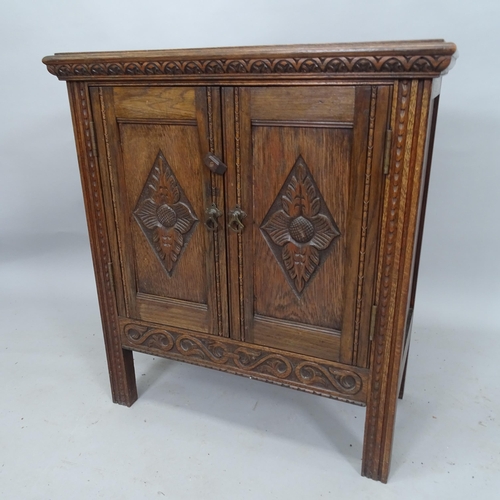 2104 - A carved oak 2-door hall cupboard, 70cm x 80cm x 35cm