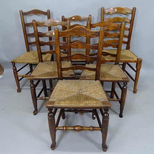 2106 - A harlequin set of 6 oak rush-seated ladder-back dining chairs