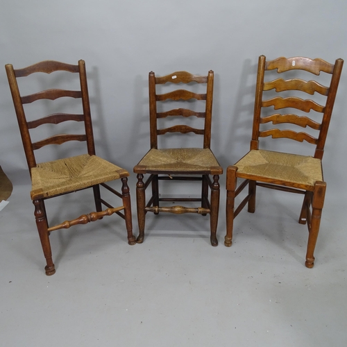 2106 - A harlequin set of 6 oak rush-seated ladder-back dining chairs