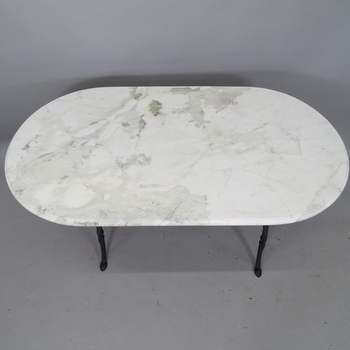 2112 - An oval marble-top garden table, on cast-iron base, 120cm x 70cm x 65cm