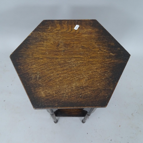 2115 - An oak 2-tier hexagonal occasional table, 41cm x 51cm