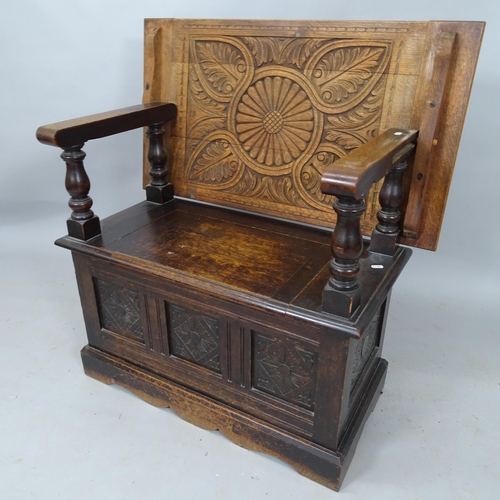 2120 - A 1920's oak carved and panelled monk's bench, with lifting seat, 91cm x 95cm x 42cm