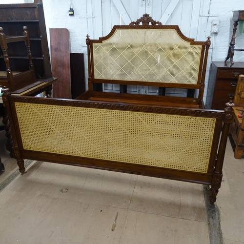 2126 - A 'And So To Bed' Emperor-sized bed, with mahogany frame and cane panels and carved decoration, incl... 