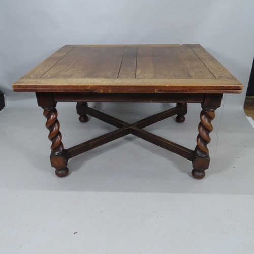 2133 - An early 20th century oak draw leaf dining table, 122cm (extending to 214cm) x 74cm x 107cm