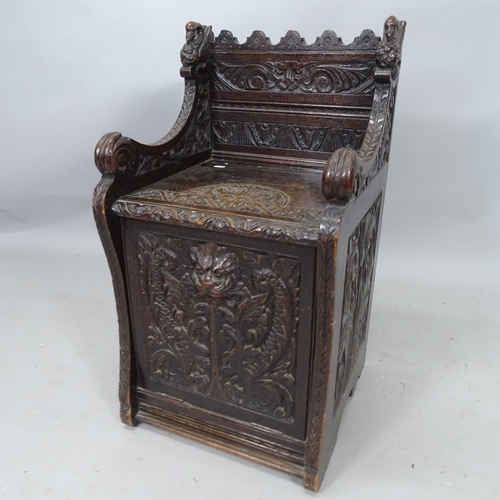 2136 - An Antique oak coal purdonium, with allover carved decoration, 45cm x 83cm x 42cm