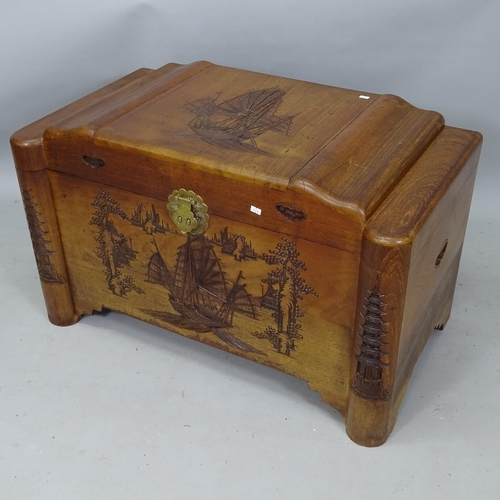 2143 - An Oriental camphorwood blanket chest, with relief carved decoration, 92cm x 56cm x 50cm