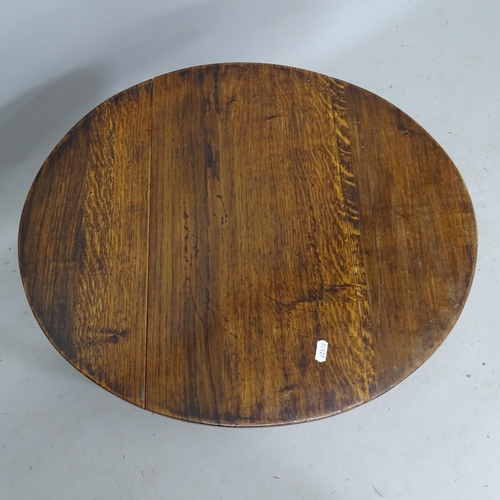 2145 - A small oak oval drop leaf table, 49cm x 45cm x 32cm