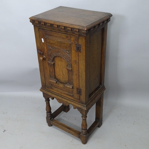 2165 - An Antique Ipswich oak design pot cupboard, with single panelled door and carved decoration, 42cm x ... 