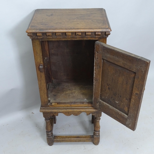 2165 - An Antique Ipswich oak design pot cupboard, with single panelled door and carved decoration, 42cm x ... 